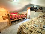 Upper level bedroom 3 with King bed, twin bed, TV